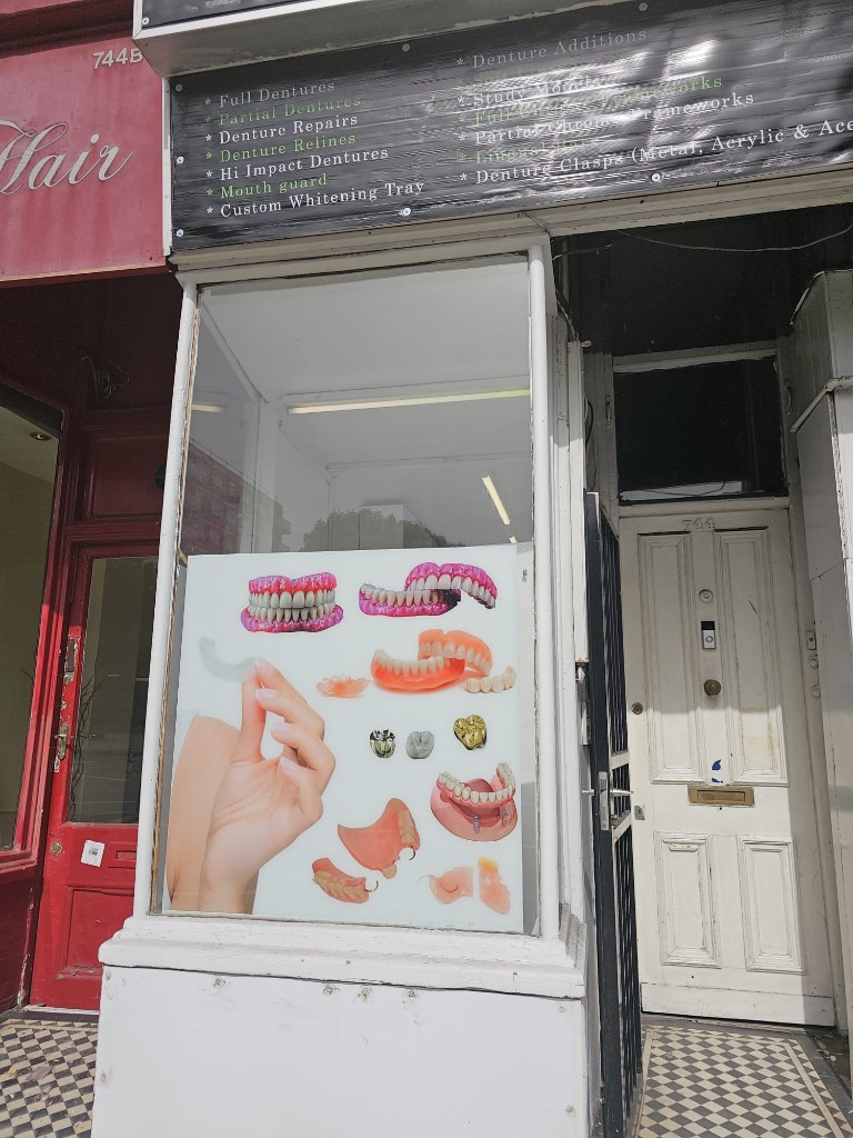 Dentaworld Ltd shop front with service list and window display
